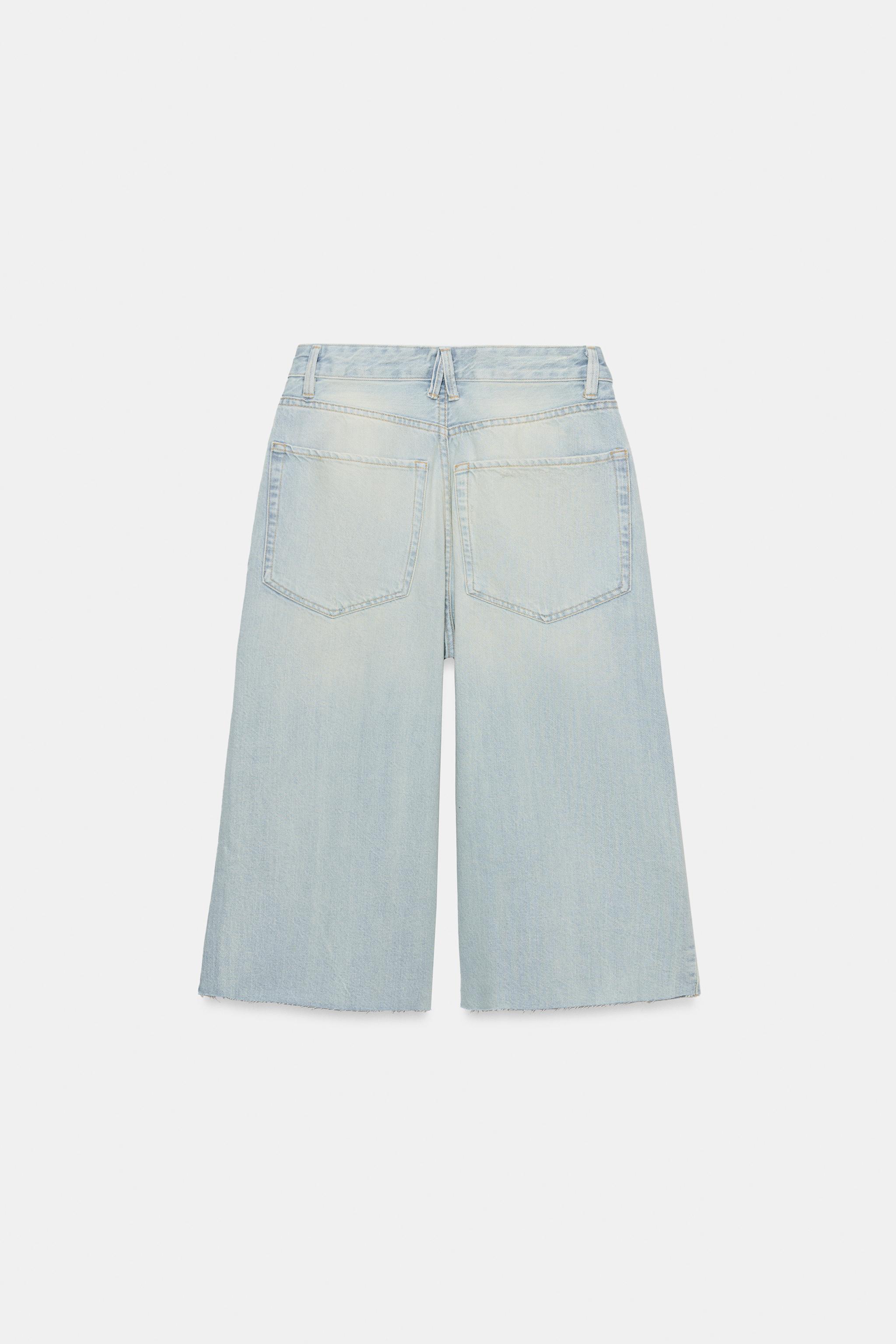 MID-RISE RIPPED DENIM JORTS